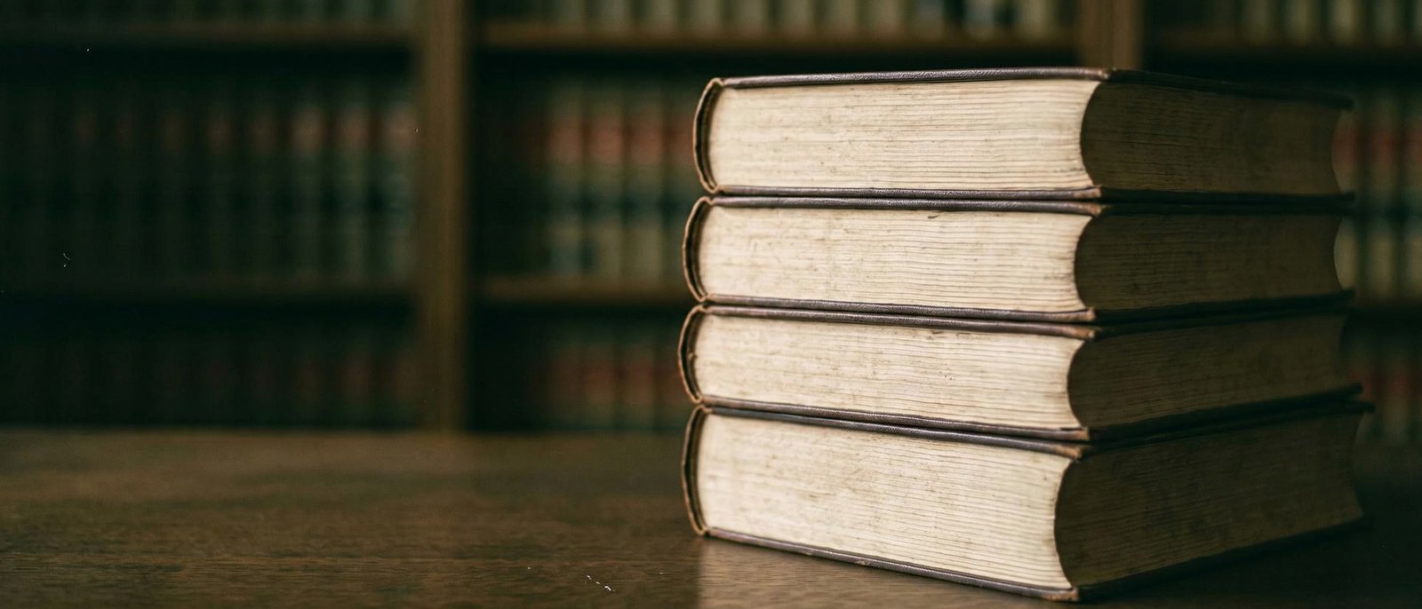 Law reports on oak shelves in shallow focus